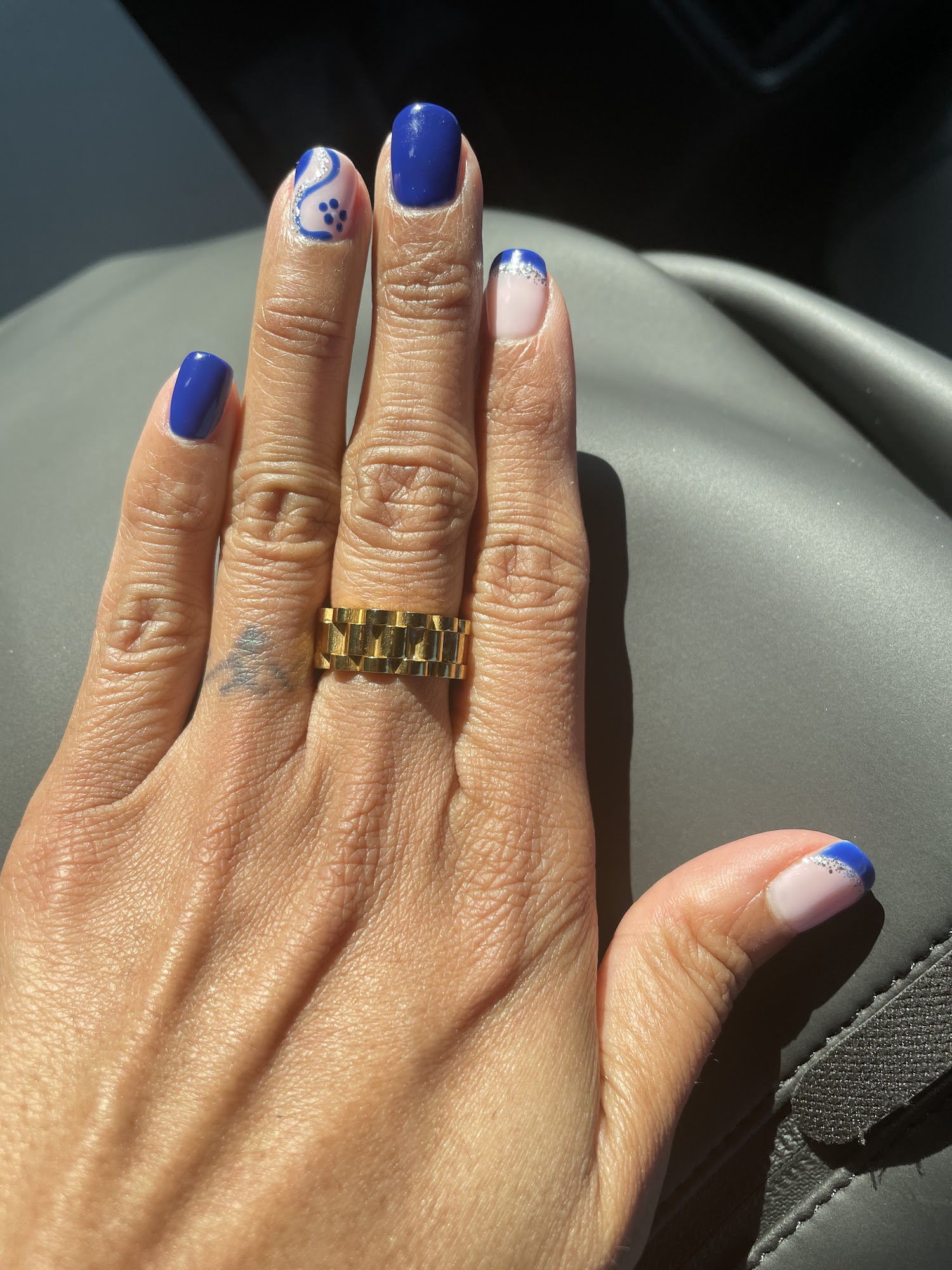 Blue and pale pink manicure with silver detail