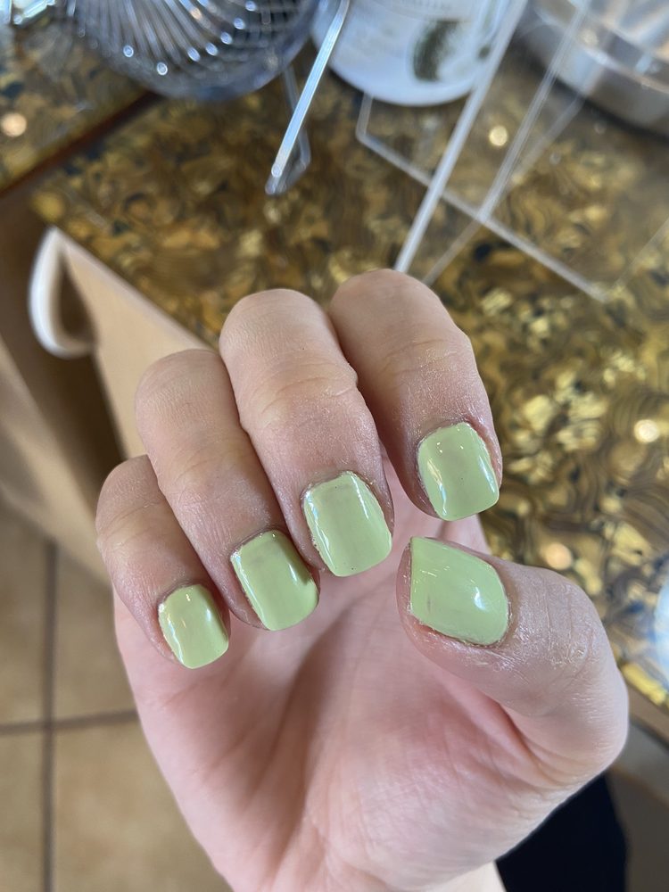 Glossy nail finish shown close up